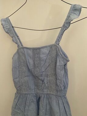 Gil’s Light Blue Ruffle Strap top